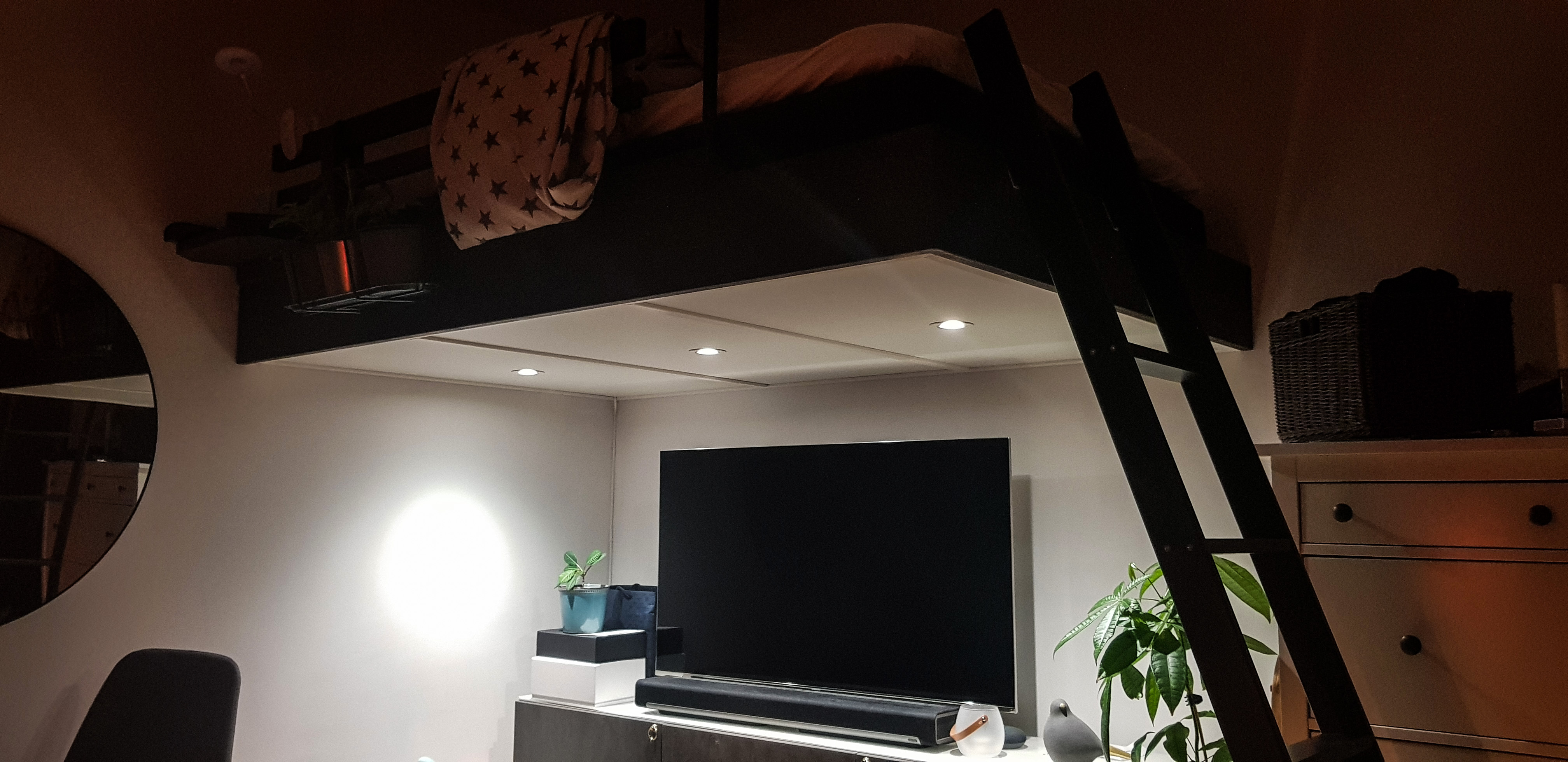 spotlight effect and cozy workspace under loftbed